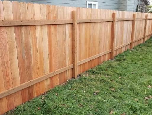 Cedar wood privacy fence install by Tazewell County Fence Co. in a Morton, IL backyard